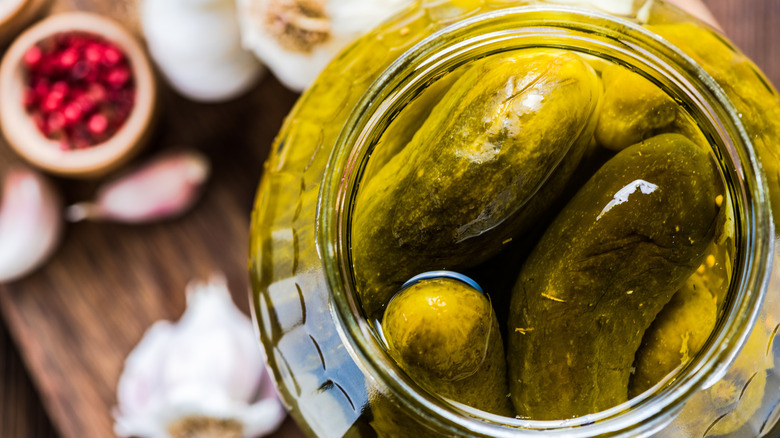 Top view of open jar of pickles