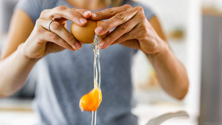 woman cracking an egg