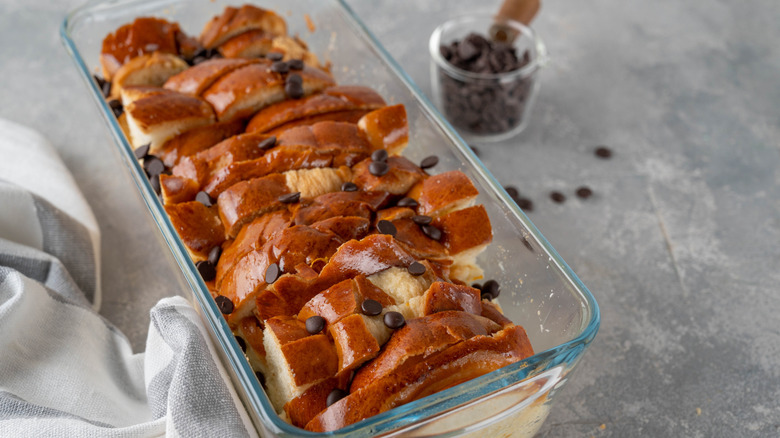 Chocolate chip bread pudding in a glass baking dish