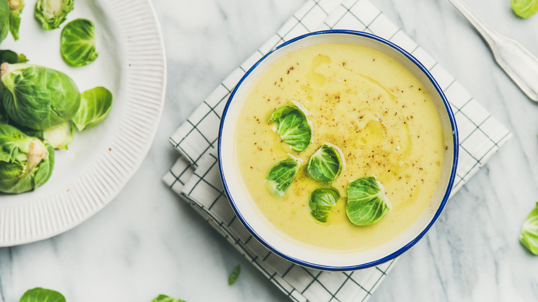 Brussels sprout soup in white bowl