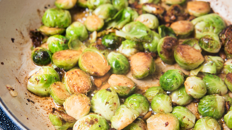 Brussels sprouts cooking in a pan