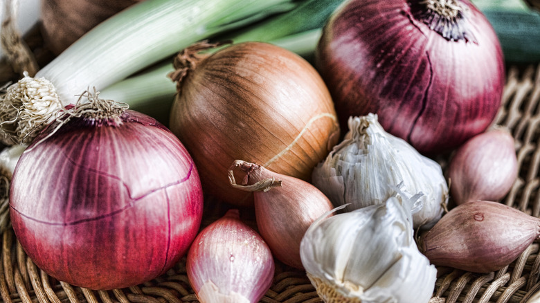 Onions, garlic, leeks, and shallots in basket