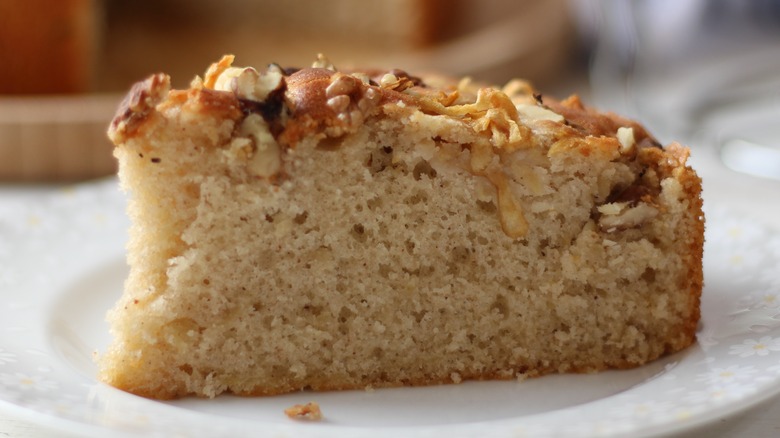 A slice of apple cake on a plate