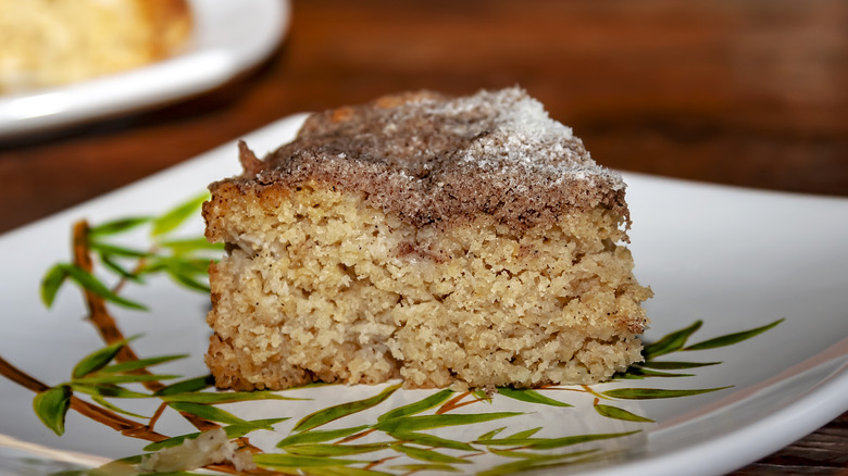 A slice of cinnamon cake on a plate