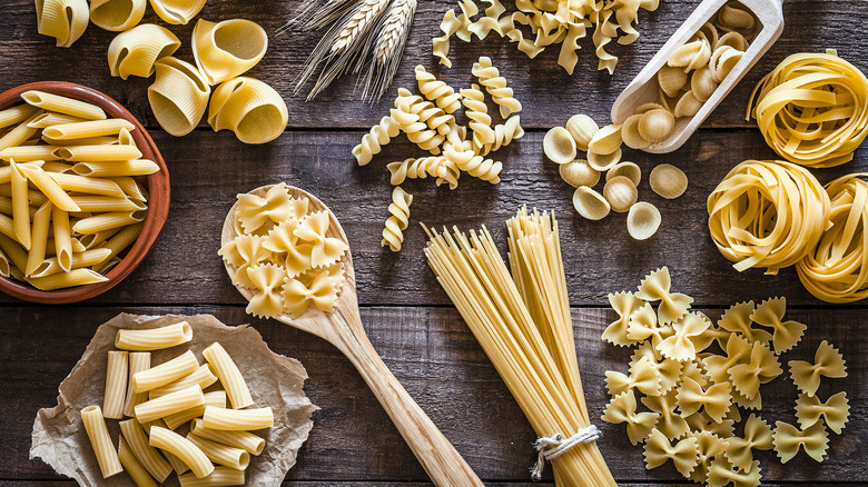 pasta varieties laid out on wooden table