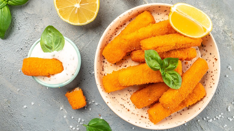 plate of fish sticks with tartar sauce