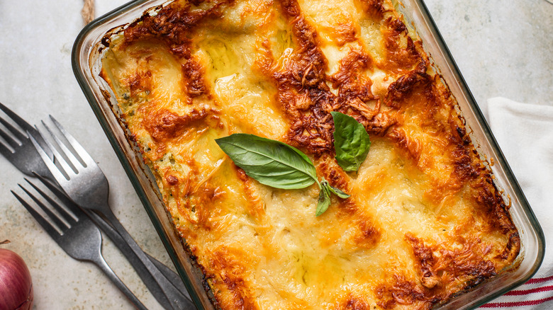 pan of lasagne with basil on top