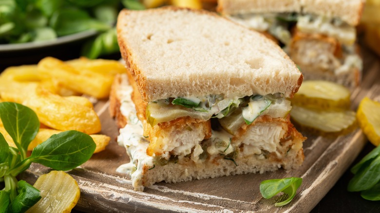 large fish stick sandwich with pickles