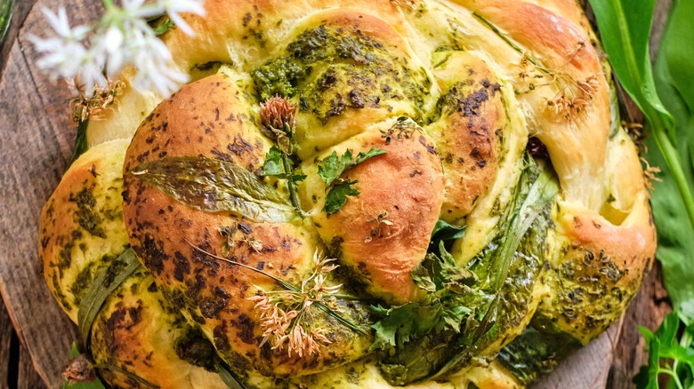 loaf of bread with pesto and herbs