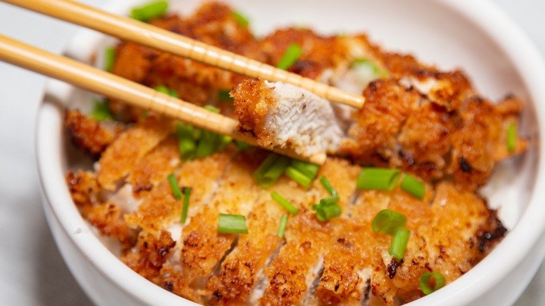 Katsudon in dish with chopsticks