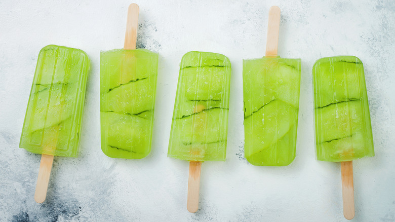 green popsicles on a counter