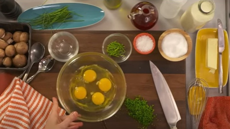 Eggs in bowl with quart of cream