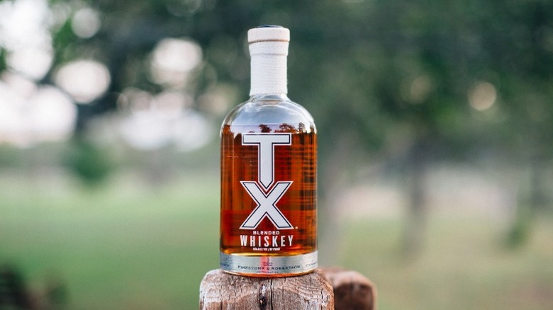 Bottle of TX Whiskey on post