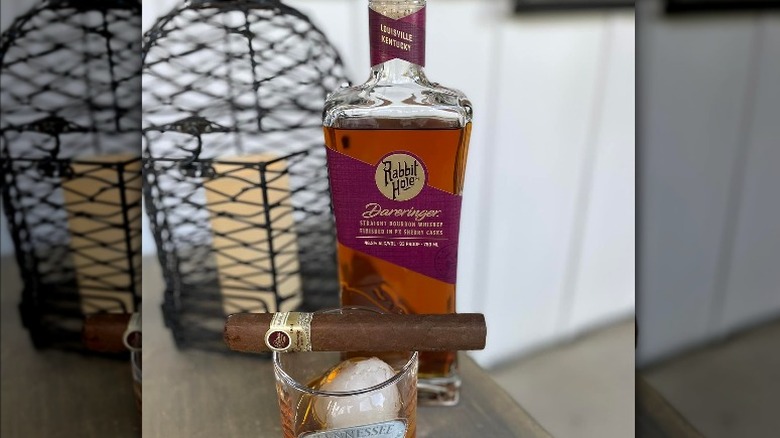 Bourbon, rocks glass, and cigar