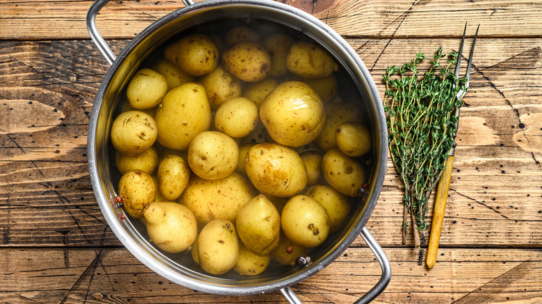 Potatoes in a pot of water to be boiled