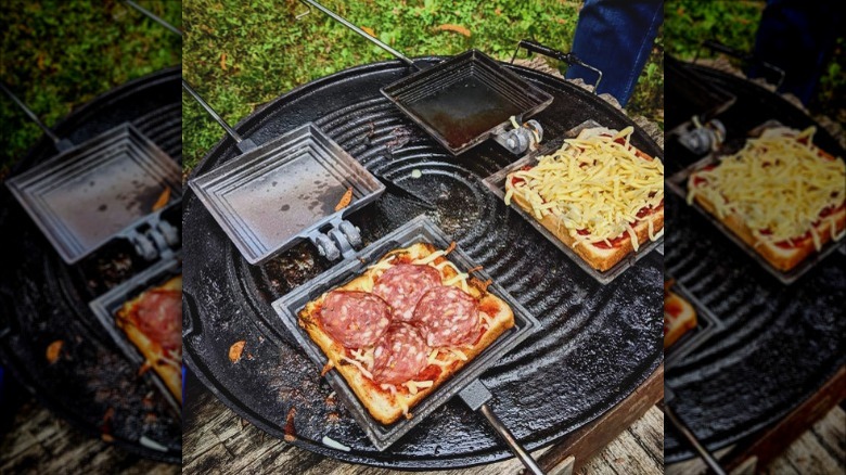 two jaffle presses on hot griddle