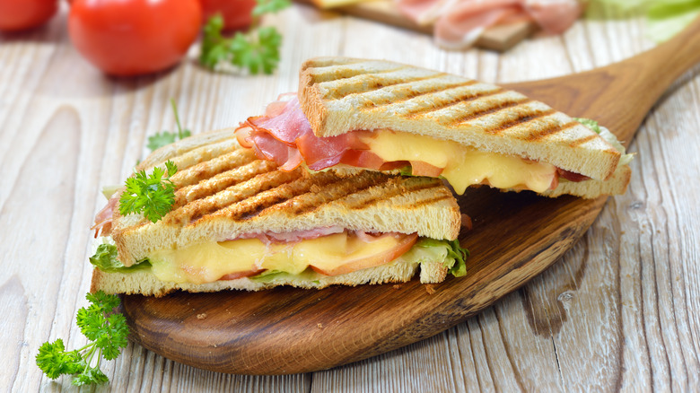 toastie with ham on cutting board