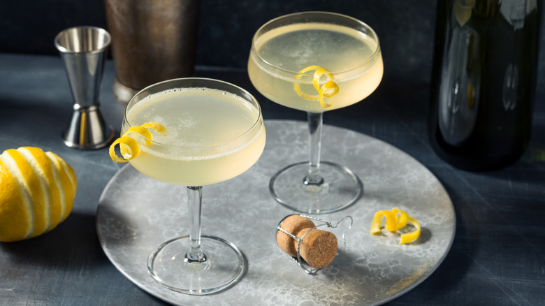 Two French 75 cocktails on a tray