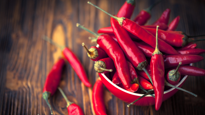 Bowl overflowing with chili peppers