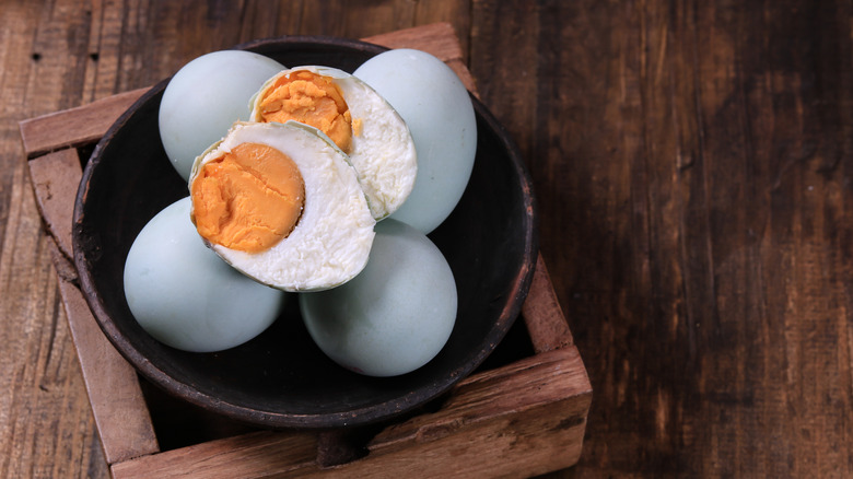 salted duck eggs served in a wooden box