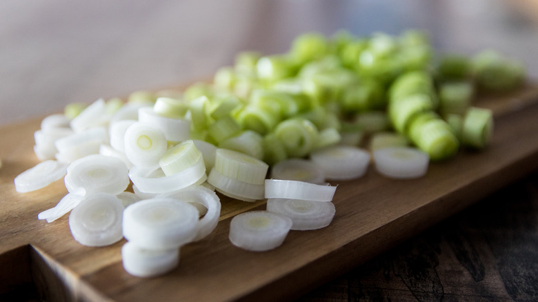 Green onions on cutting board