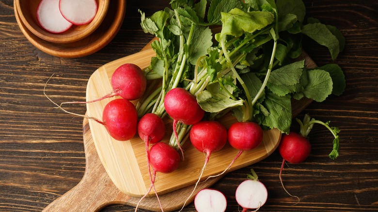 Radishes on cutting board