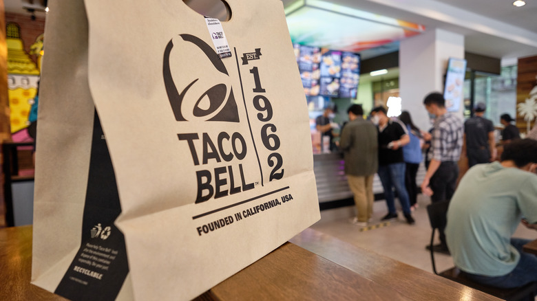 brown bag with taco bell logo in restaurant