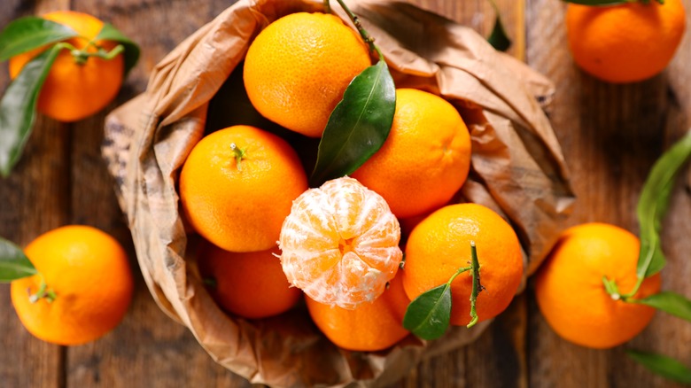 Oranges in a brown paper bag