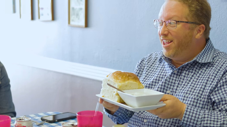 man holding massive biscuit