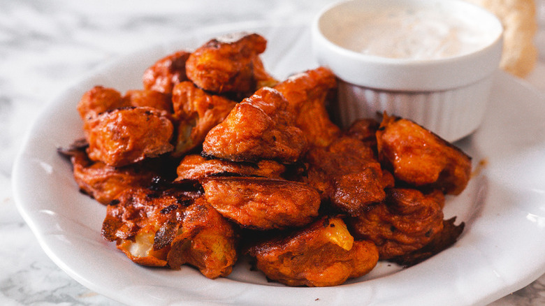 bowl of Buffalo cauliflower with dip