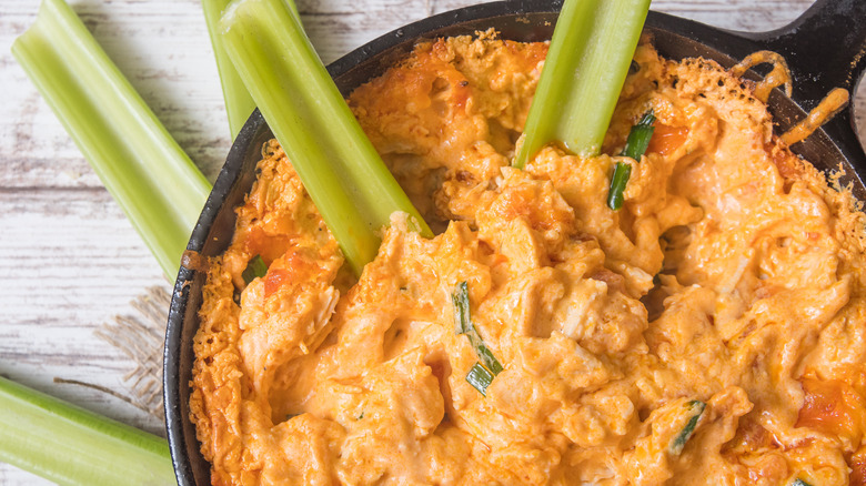 Celery sticks with spicy cheesy dip