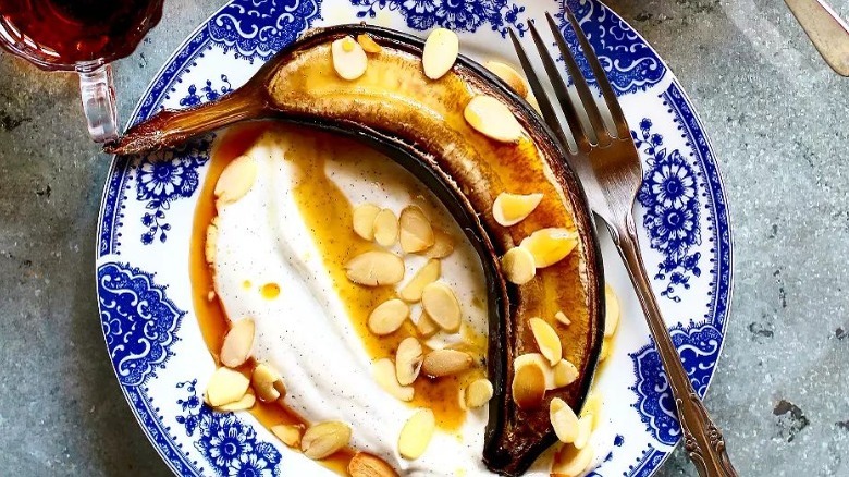 air-fried banana with whipped cream and almonds