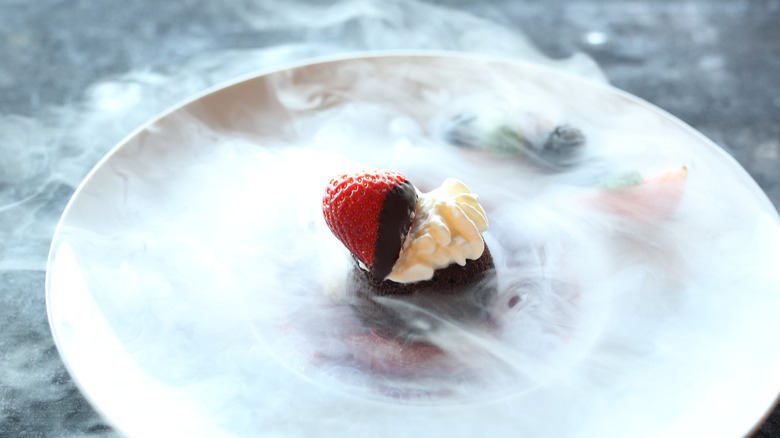 Liquid nitrogen smoking strawberry dessert