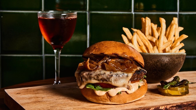 Burger with fries and wine