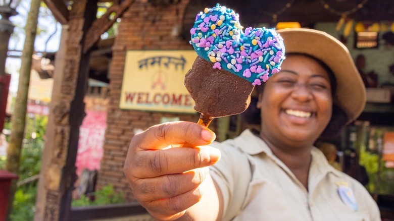 Woman holding Mickey Premium Bar ice cream