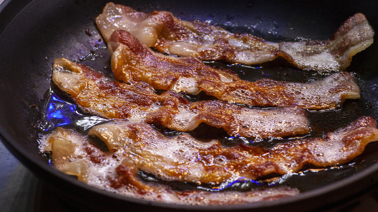 Bacon frying in a pan