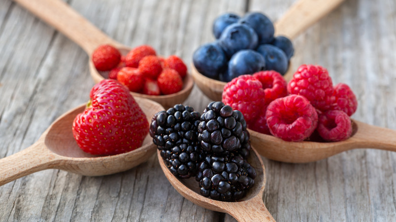 Wooden spoons with assorted berries