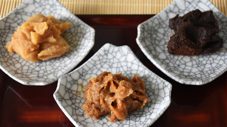 Three types of miso paste displayed on small dishes