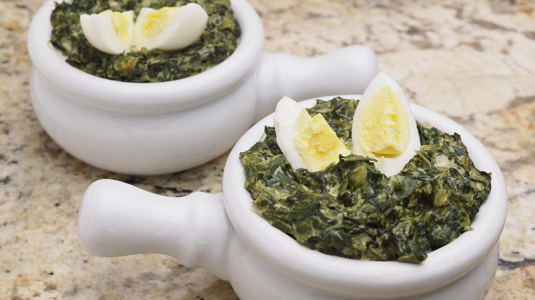 Creamed spinach bowls with hard-boiled eggs