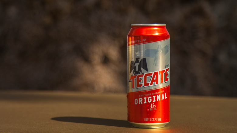 Tecate Original Lager on dark background