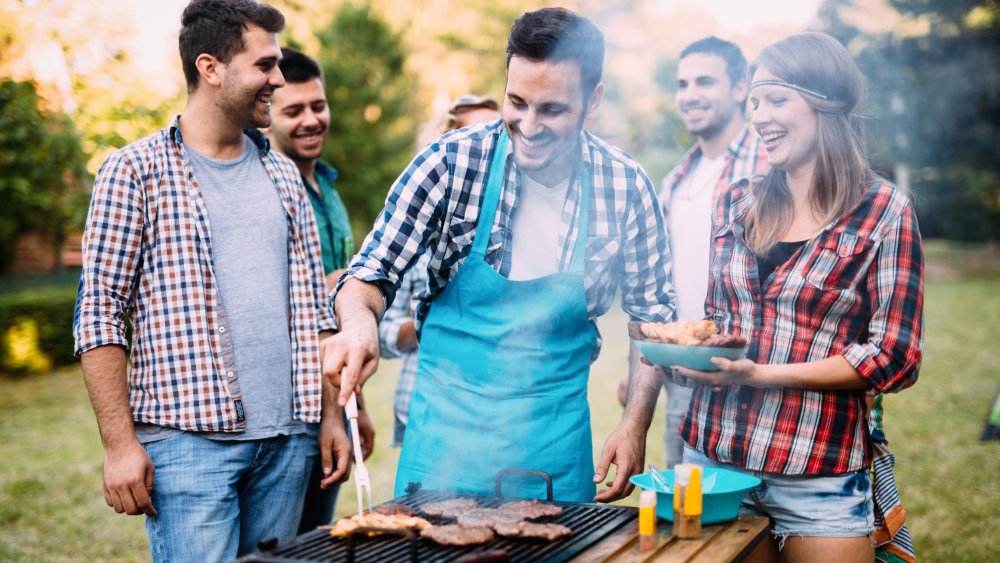 People grilling burgers