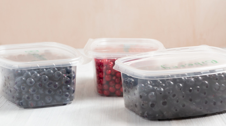 Plastic containers full of washed berries