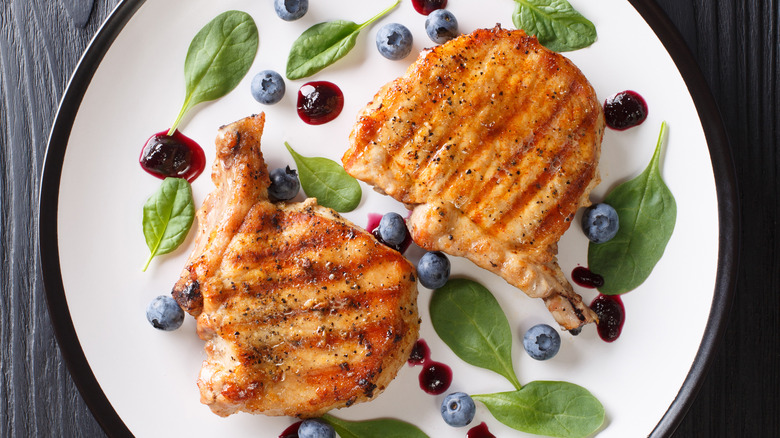 Grilled chicken on plate with blueberries