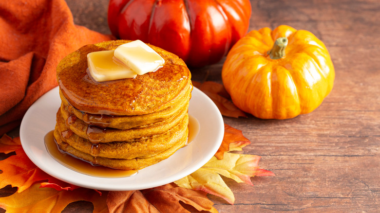 stacked pumpkin pancakes on plate