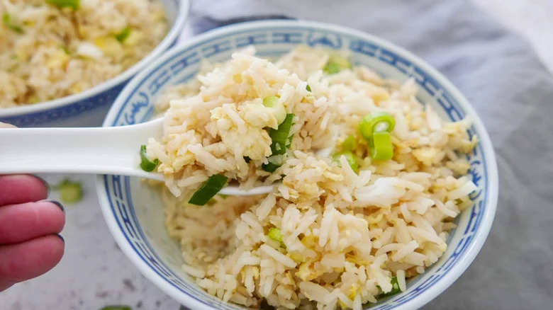 egg-fried rice in a bowl with a spoon