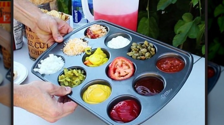 muffin tin filled with condiments