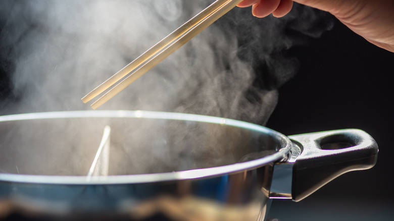 Chopsticks over pot