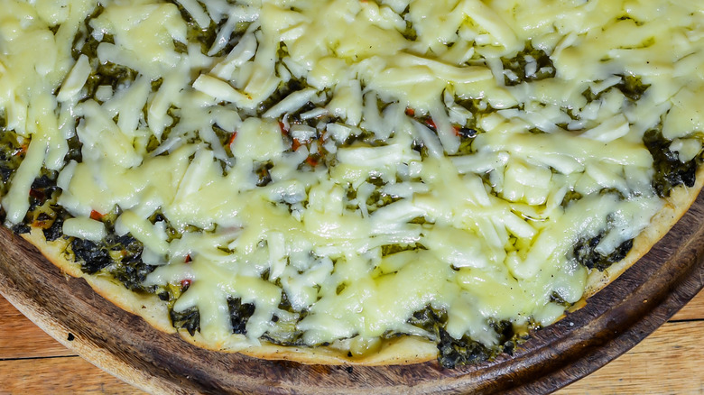 chimichurri sauce pizza on wooden board