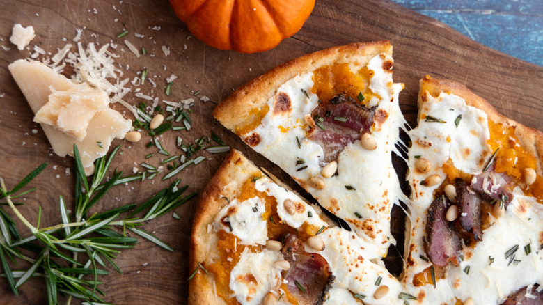 pizza with pumpkin sauce with rosemary and cheese