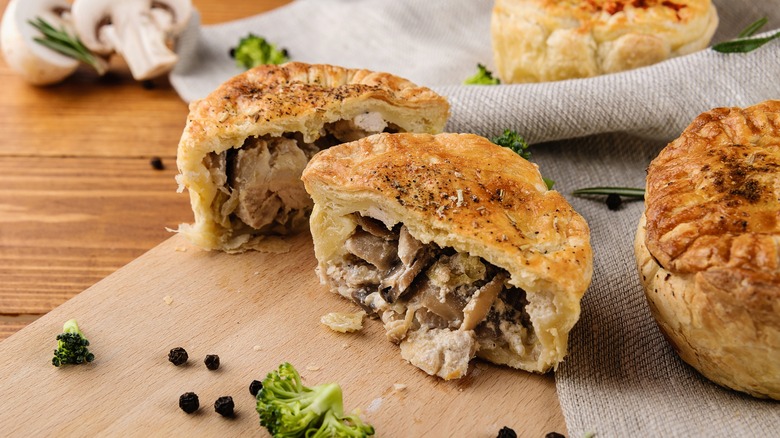 Aussie beef pies on cutting board